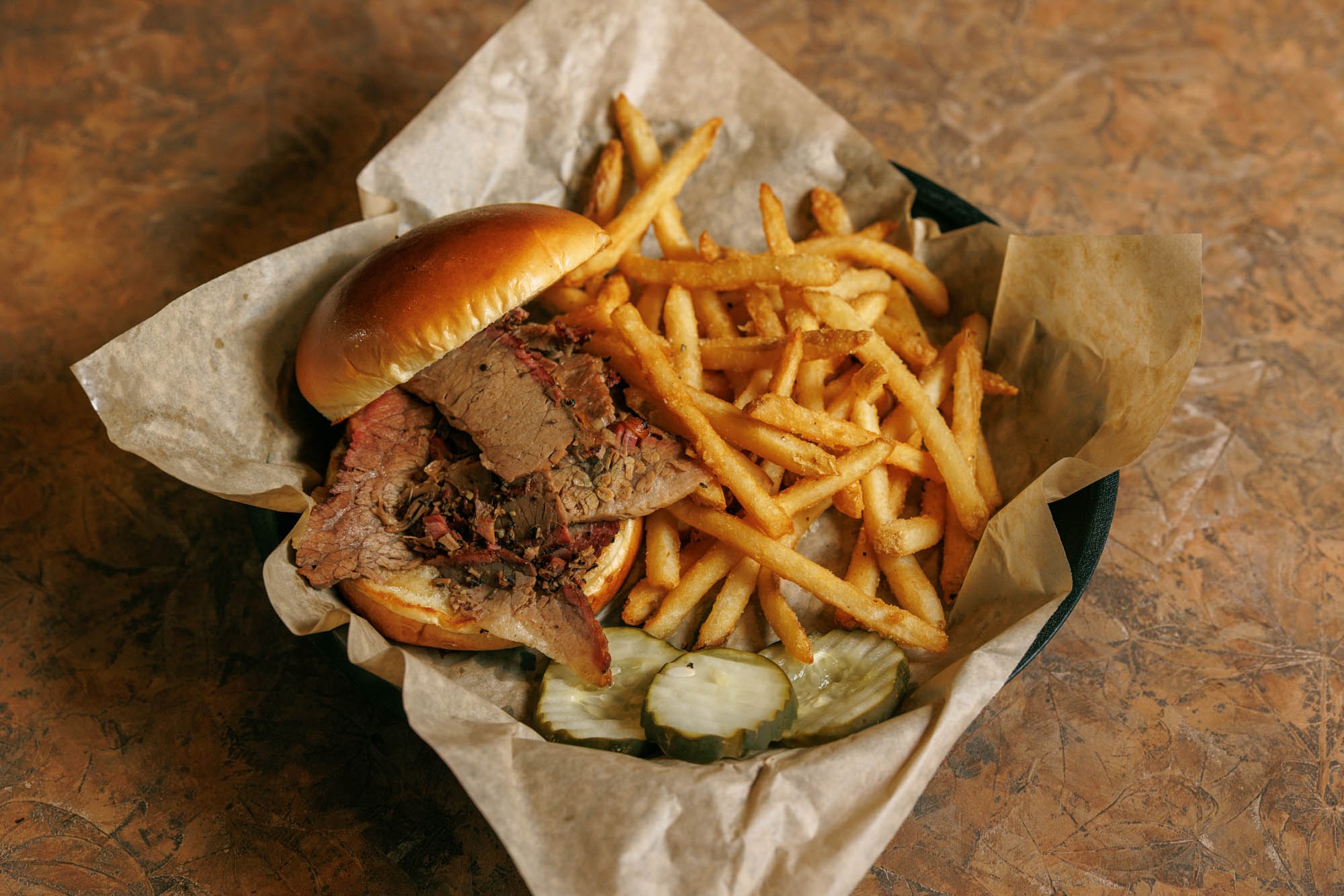 Texas beef brisket sandwich with fries